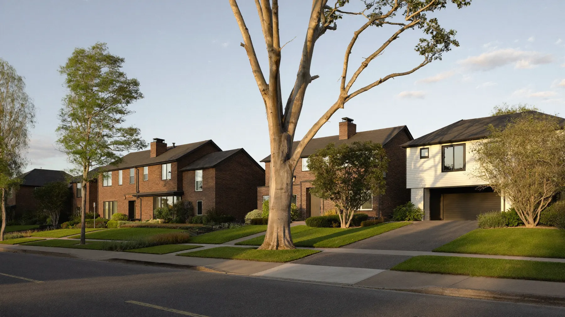 Quiet Manning street with brick family homes at golden hour