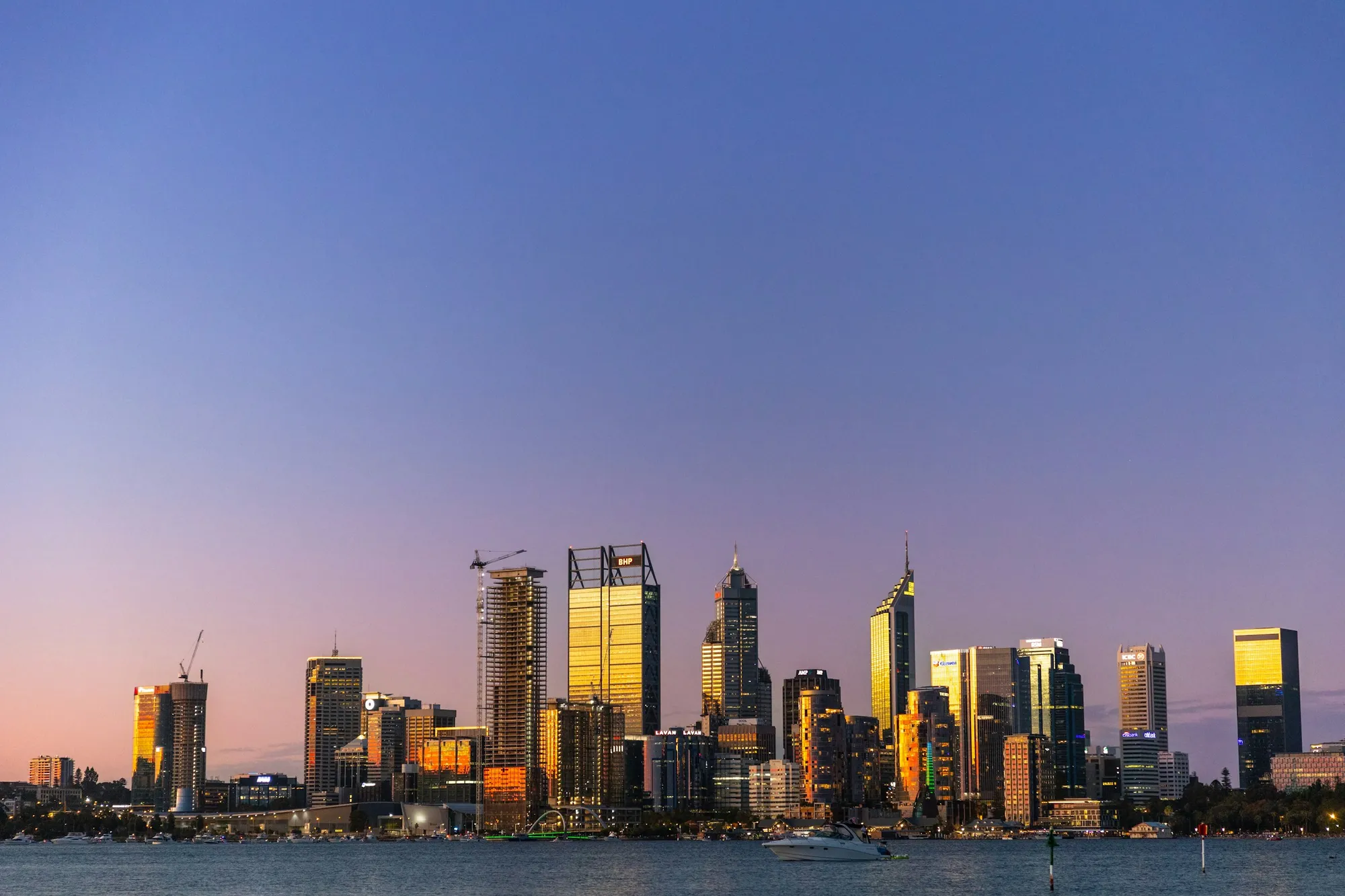 South Perth foreshore at dusk with the Perth city skyline across the Swan River